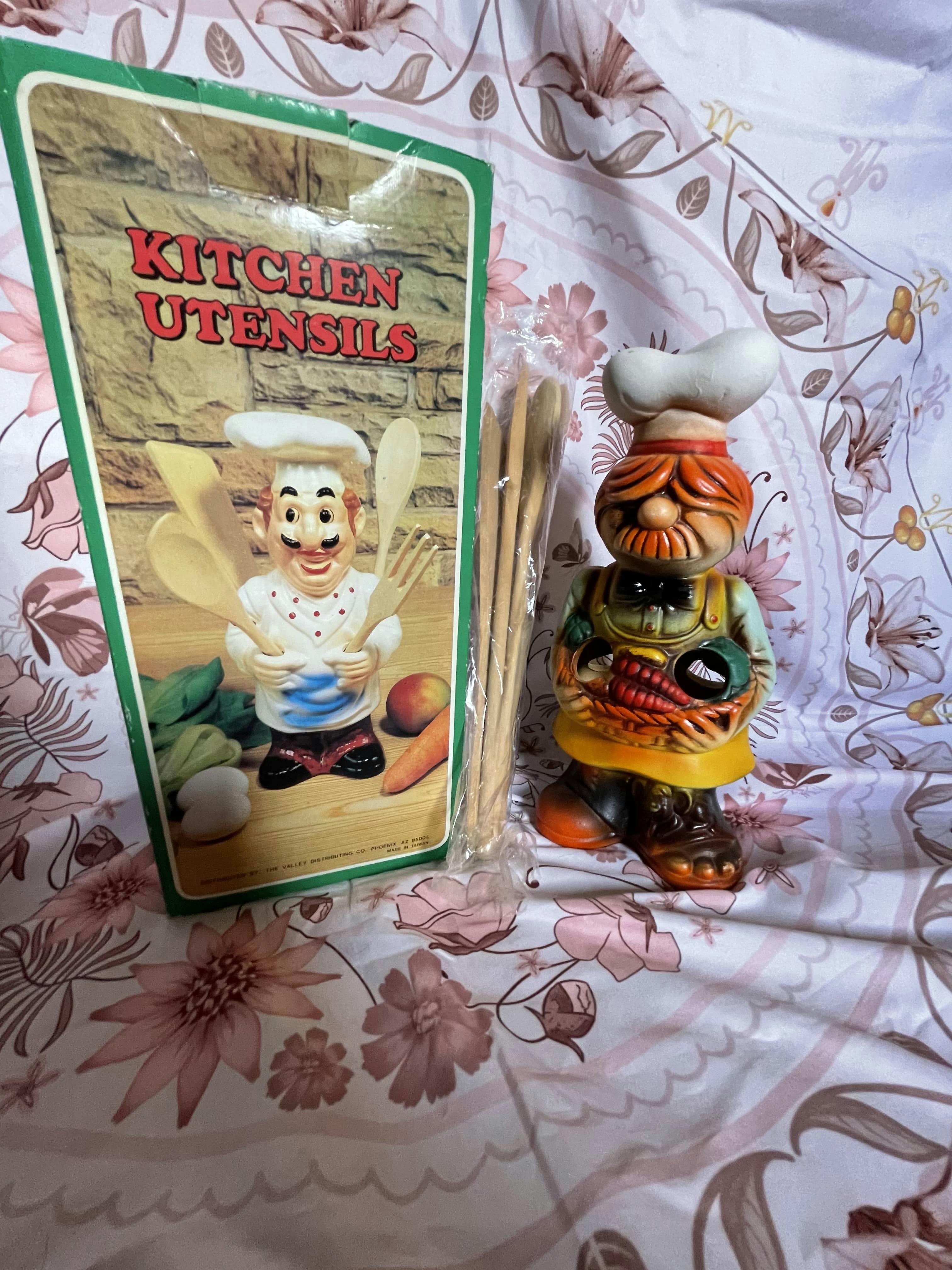 Vintage French Funny "Swedish" Chef Utensil Holder with utensils in plastic bag next to green card reading "KITCHEN UTENSILS"