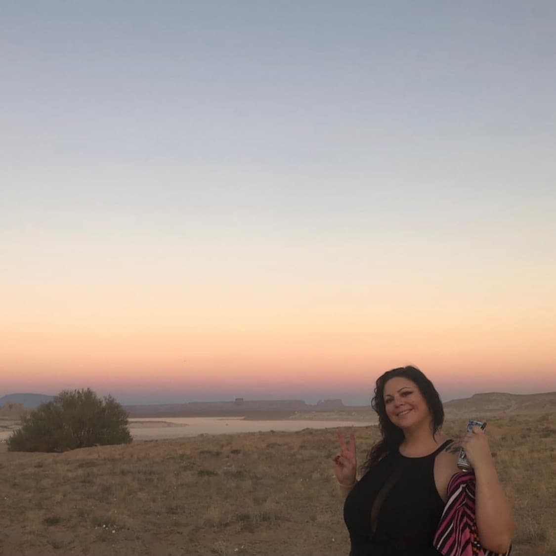 Picture of the owner of Petite Curio Boutique, Lucia Williams, at the beach